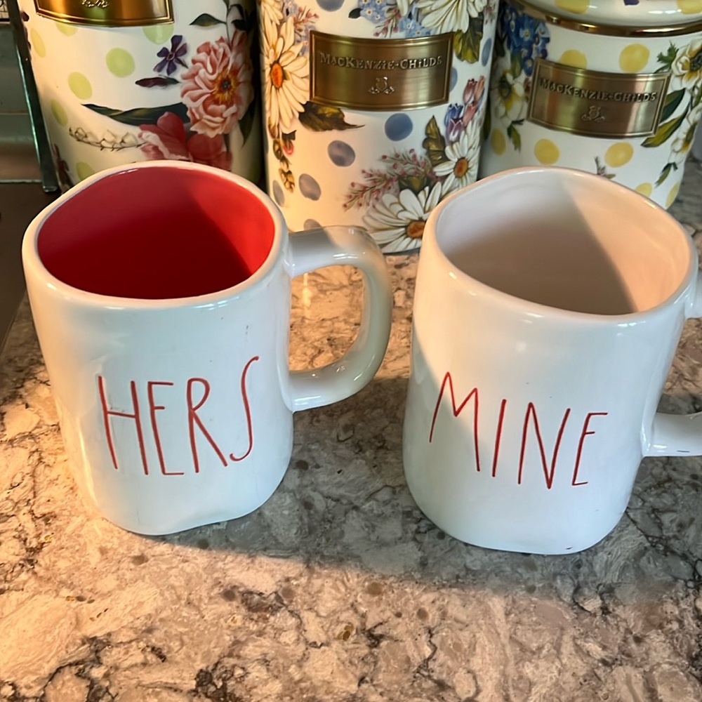 2 Rae Dunn mugs.  Great shape HERS and MINE.  Hers is lined in rose color